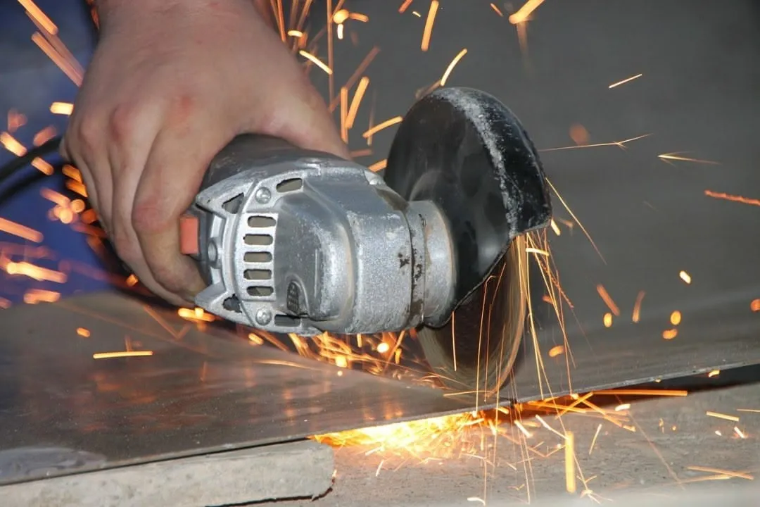 Cutting sheet of metal with hand saw